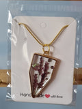 Resin pendant and chain.