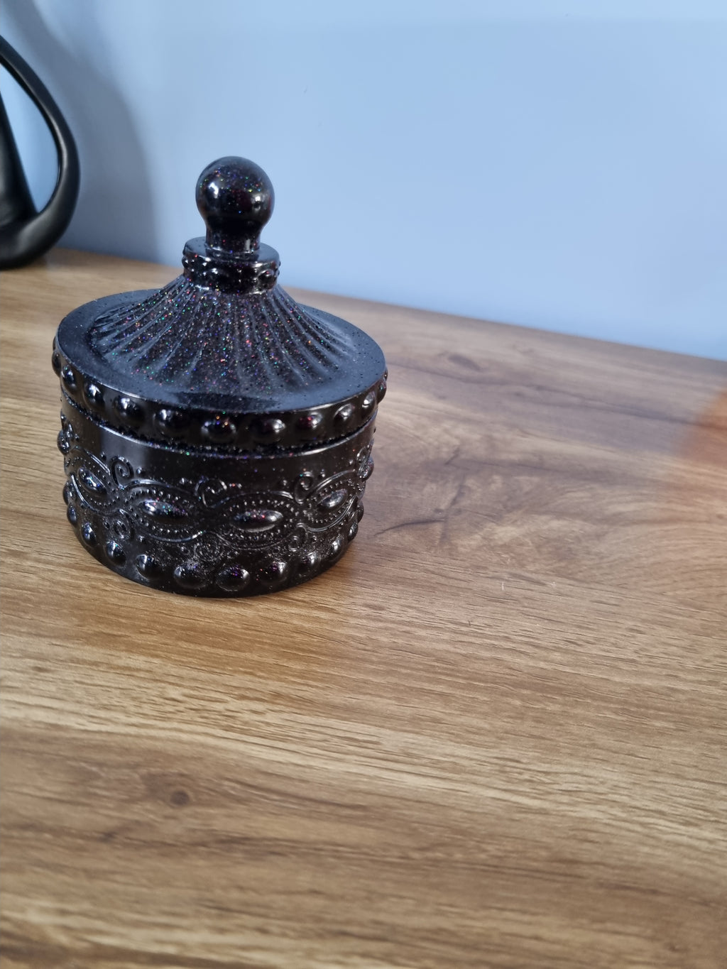 Small decorative storage jar.