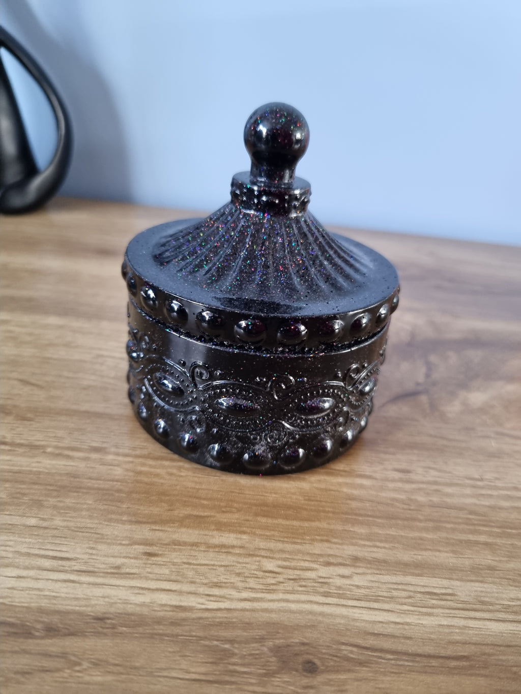Small decorative storage jar.