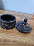 Small decorative storage jar.