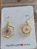 Gold and white earrings