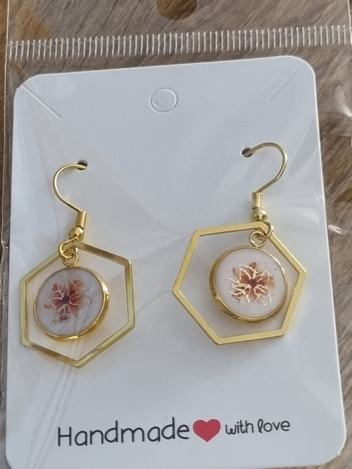 Gold and white earrings